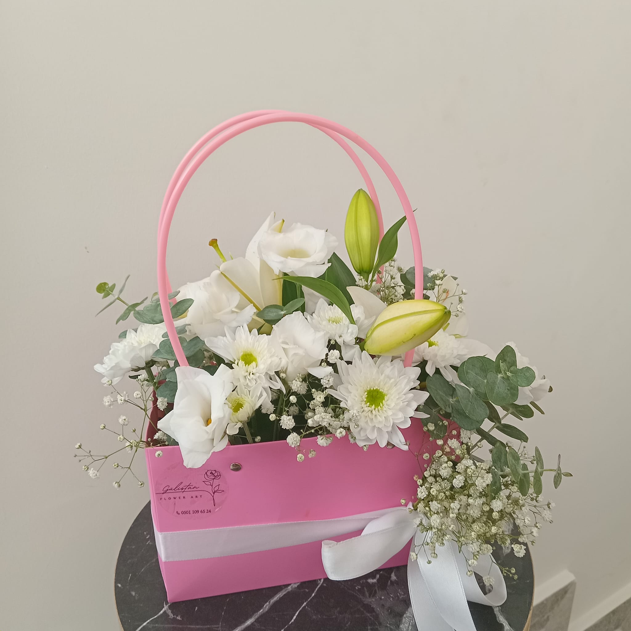 White Flowers in a Pink Bag